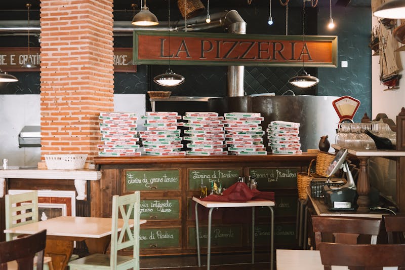 Anthony's coal fired pizza team working together in restaurant